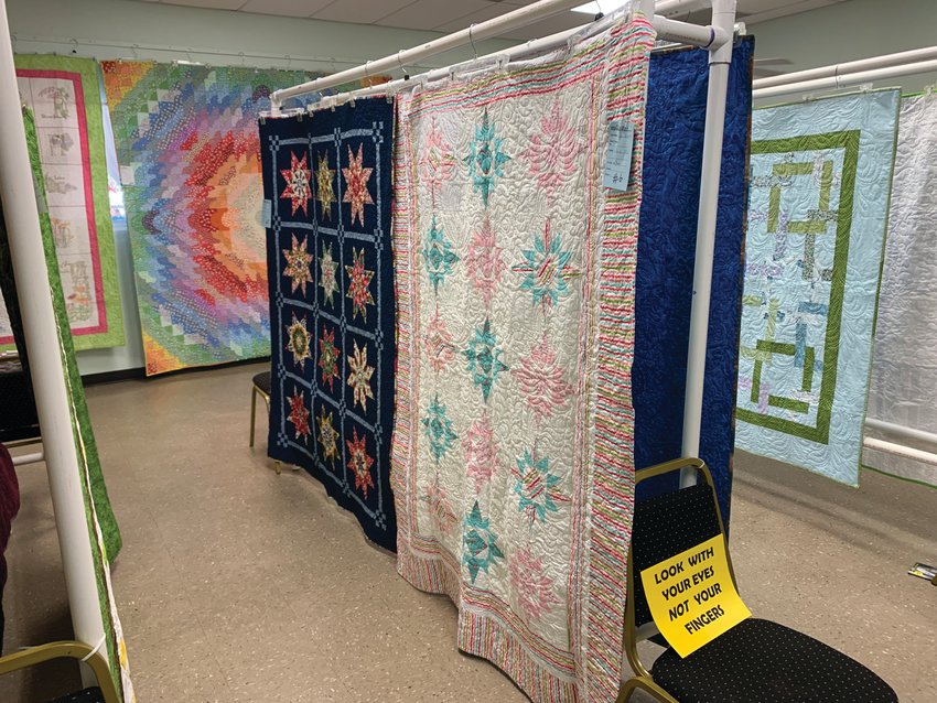 At the Sour Orange Festival Quilt Show, visitors voted for their favorite quilts in three categories. [Photo by Katrina Elsken/Lake Okeechobee News]